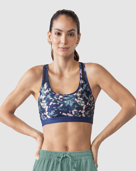 Top deportivo con espalda atlética en material de secado rápido#color_a63-estampado-hojas-azul