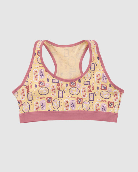 Top con espalda deportiva elaborado en algodón para niña#color_952-amarillo-estampado-flores