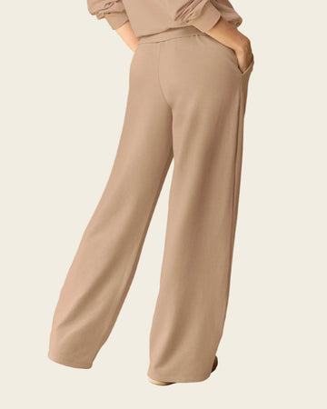Pantalón bota amplia con elástico y tira anudable en cintura#color_c54-arena