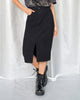 Falda midi con abertura en frente y bolsillos funcionales en frente y posterior#color_700-negro
