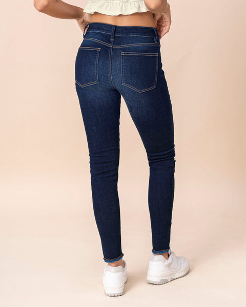 Jean skinny tiro medio con detalles desgastados#color_052-azul-medio