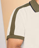 Camiseta tipo polo con botones funcionales  y mangas y cuello tejidos#color_000-blanco